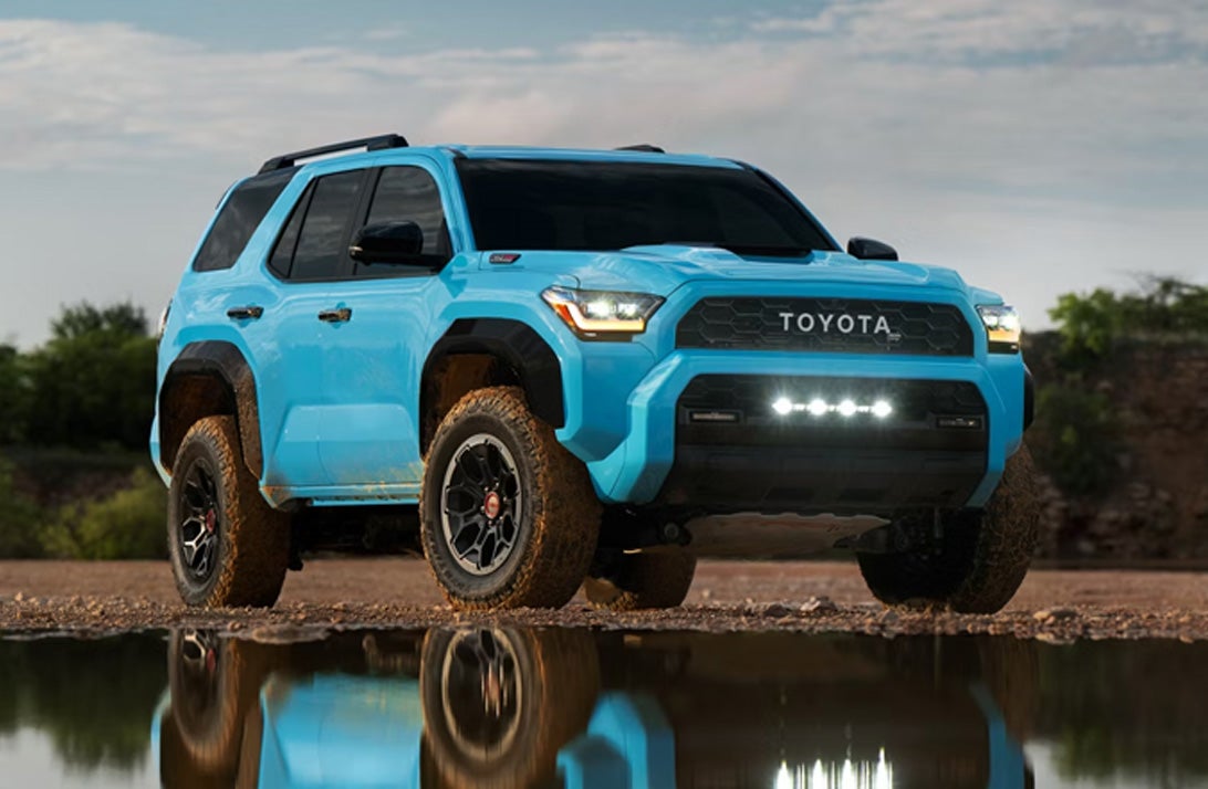 Blue Toyota SUV driving off road